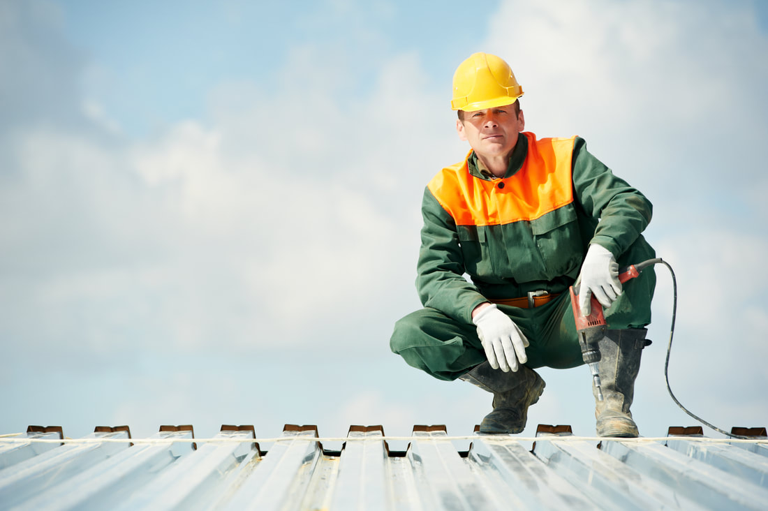 Worker pose on metal roof