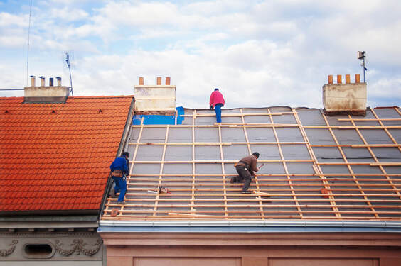 Workers installing roof lattice